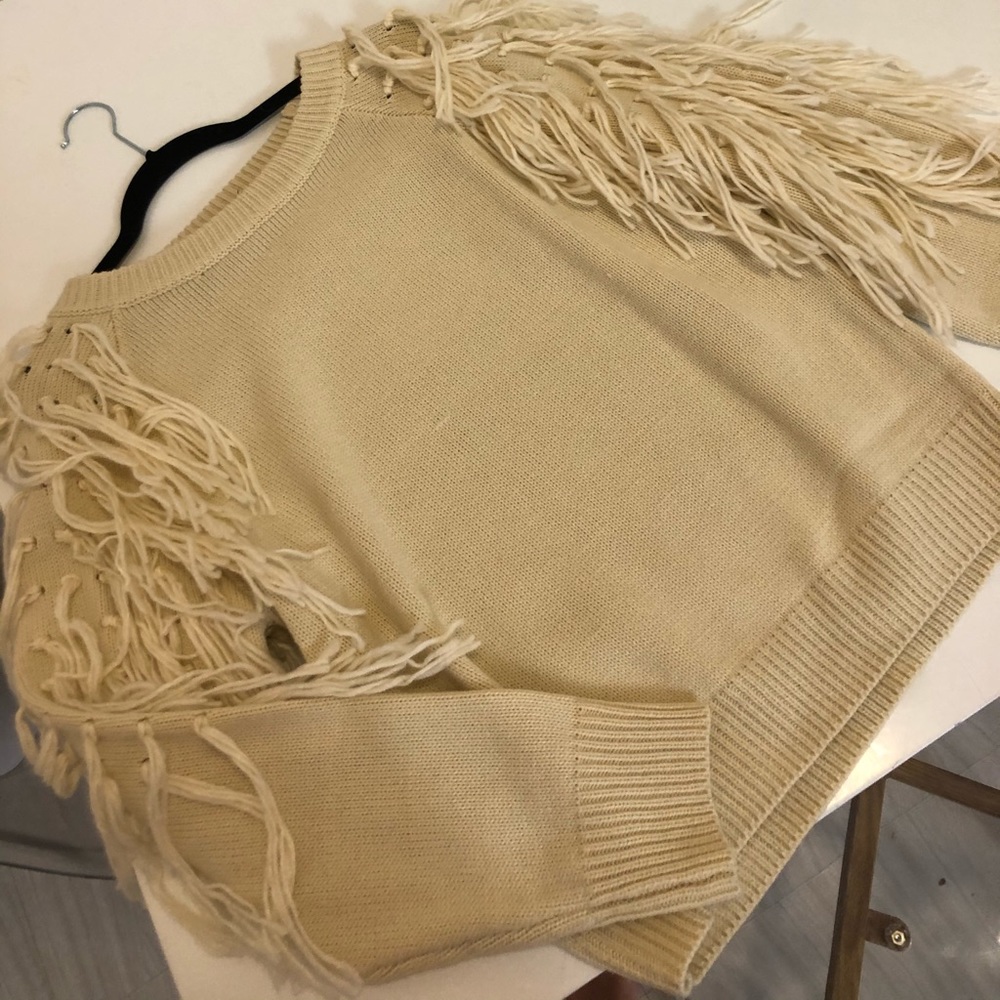 Never worn Pull over fringed sweater